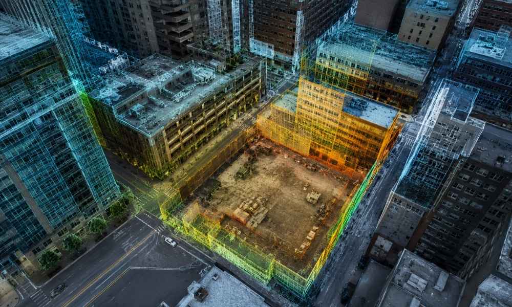 Aerial view of a downtown redevelopment site with a LiDAR scan showing nearby buildings, streets, and existing site conditions