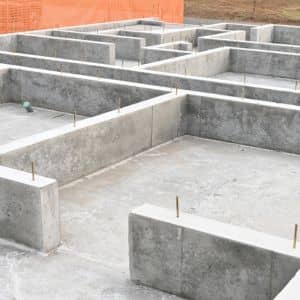 Concrete building foundation showing elevation levels for flood elevation surveys