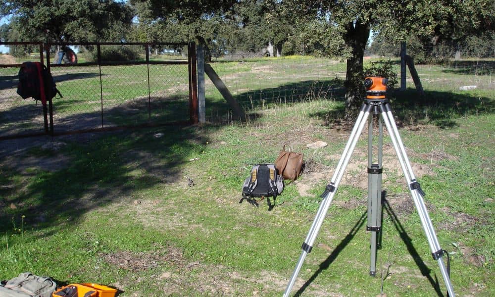 Surveying equipment set up for flood elevation surveys on open land