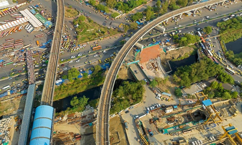 Aerial view of urban roads, rail lines, and construction areas commonly captured using lidar mapping for infrastructure planning