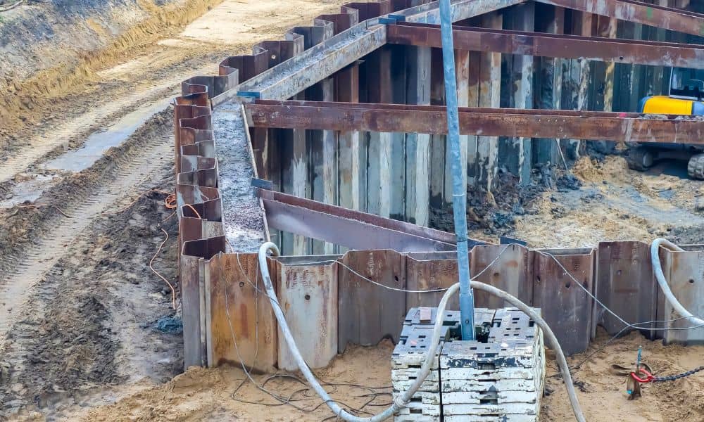 Paused excavation site showing how construction surveys often get delayed during uncertain project timelines