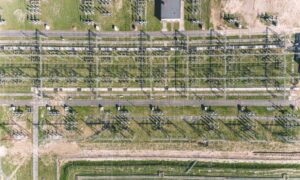 Data center power substation aerial - ALTA SURVEY Chicago Aerial view of power substation near industrial land for data center development with an ALTA land survey in planning
