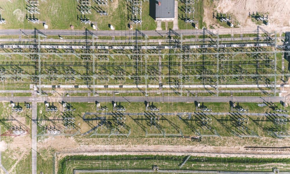 Aerial view of power substation near industrial land for data center development with an ALTA land survey in planning